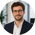 Michael Peters, a data analyst at PingPrice, poses for a professional headshot in an office setting